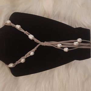 Waterfall of pearls necklace on long gray leather multi tiered cords.